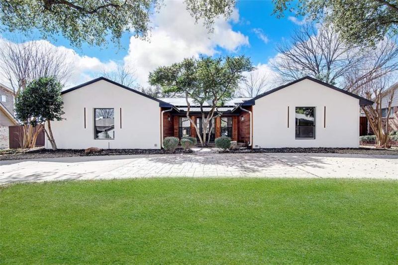 This striking modern home, set on a beautifully landscaped
