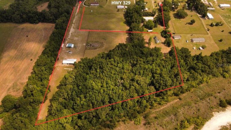 10+ Acre Property with Extensive Improvements –