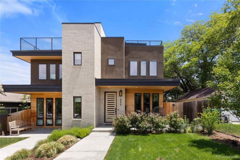 Welcome to 3556 S Emerson Street, a residence that stuns with over