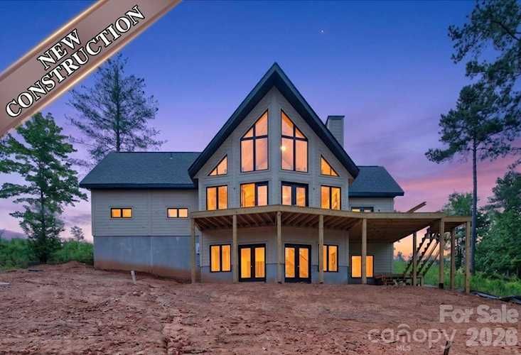 Welcome to lakefront living at its finest in the prestigious