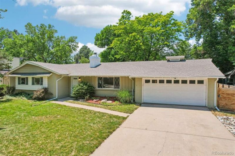 Nestled on a beautifully landscaped 10,400 sq ft lot in Denvers highly sought-after Winston Downs neighborhood