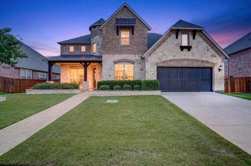 Exceptional 5-bedroom, 4 full and 1 half bath home with a 3-car tandem garage,